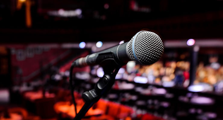 A microphone in front of a concert hall